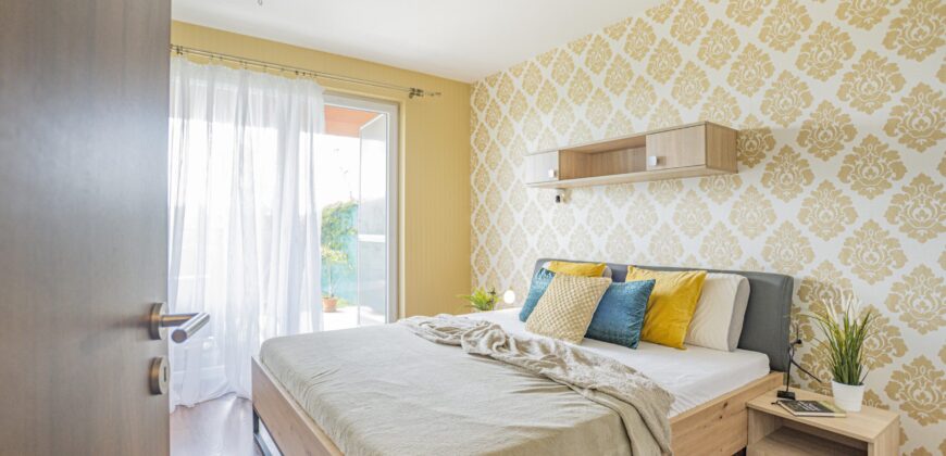 Prodej bytu 2+kk 53,2m2 se zahrádkou a garážovým stáním